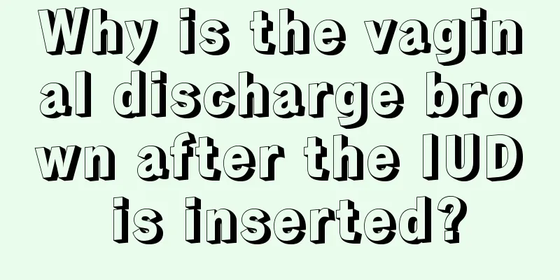 Why is the vaginal discharge brown after the IUD is inserted?