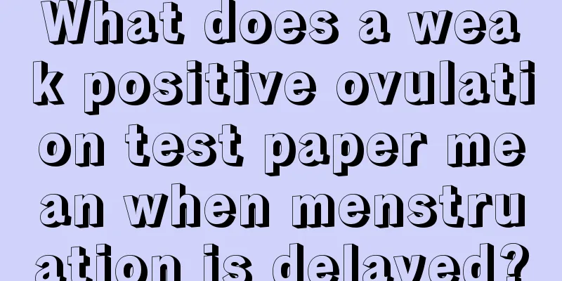 What does a weak positive ovulation test paper mean when menstruation is delayed?