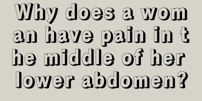 Why does a woman have pain in the middle of her lower abdomen?