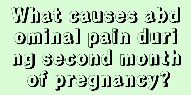 What causes abdominal pain during second month of pregnancy?