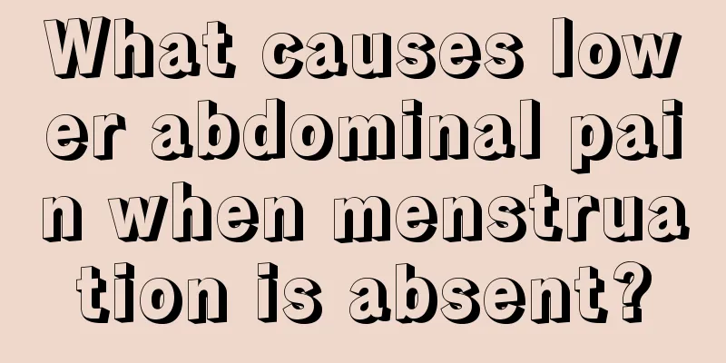 What causes lower abdominal pain when menstruation is absent?