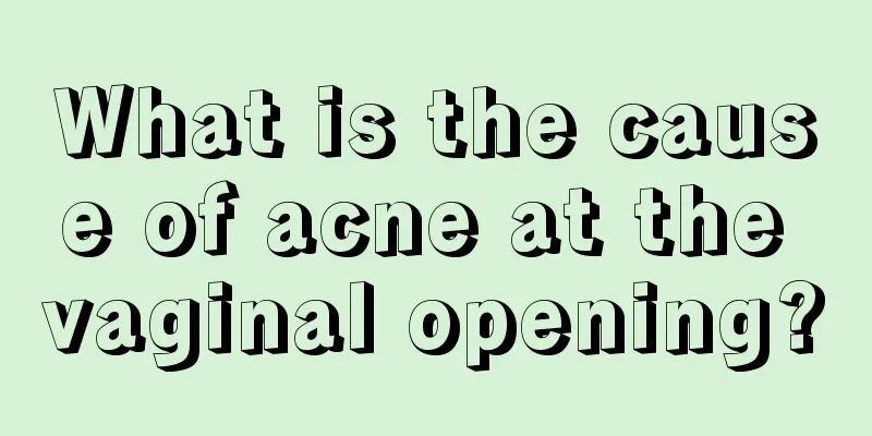 What is the cause of acne at the vaginal opening?