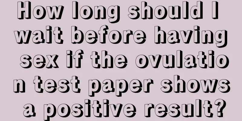 How long should I wait before having sex if the ovulation test paper shows a positive result?