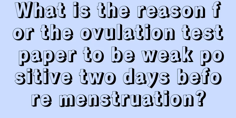 What is the reason for the ovulation test paper to be weak positive two days before menstruation?