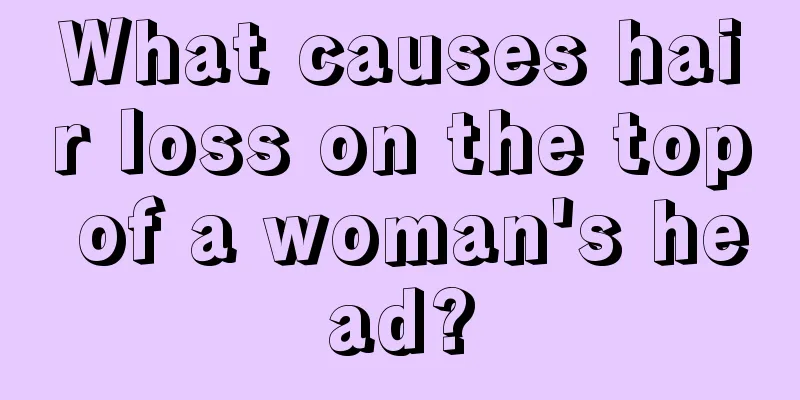 What causes hair loss on the top of a woman's head?