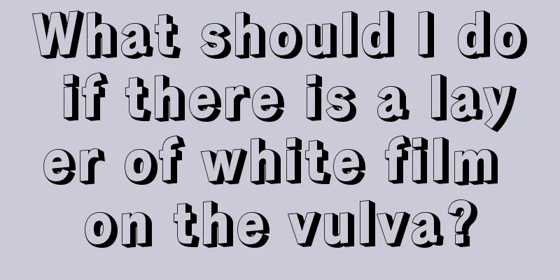 What should I do if there is a layer of white film on the vulva?