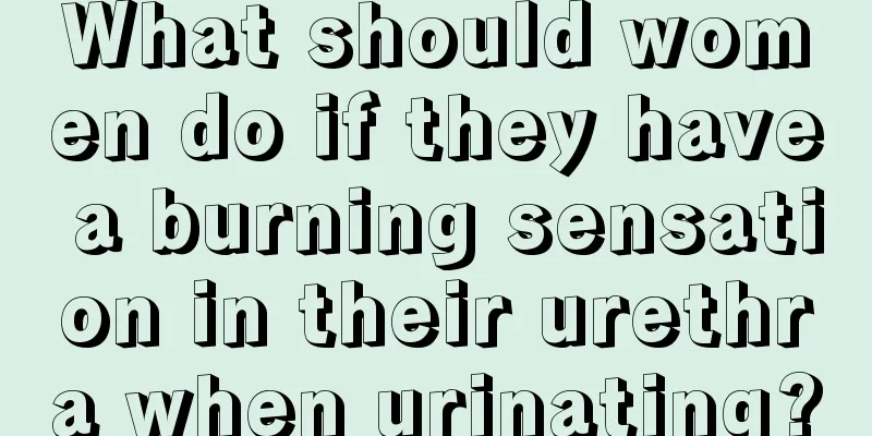 What should women do if they have a burning sensation in their urethra when urinating?