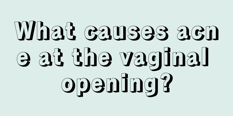 What causes acne at the vaginal opening?