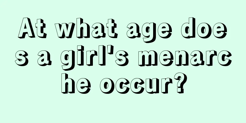 At what age does a girl's menarche occur?