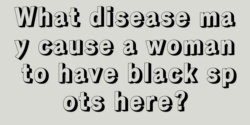 What disease may cause a woman to have black spots here?